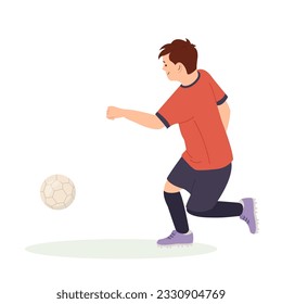 Teenage boy football player, in a red sports shirt, kicks a soccer ball. Kid sportsman playing football game, dynamic practicing. Cartoon vector illustration in flat style isolated.