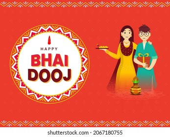 Teenage Boy And Girl Holding Plate Of Laddu (Sweet Balls) With Gift Box For Happy Bhai Dooj Festival.