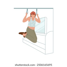 A teenage girl hanging from the overhead handrails on a subway car