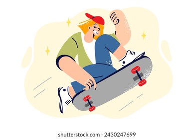 Teenage girl rides skateboard, doing extreme tricks and enjoying active form of recreation. Schoolgirl makes victory gesture jumping on skateboard and rejoicing at having interesting hobby.