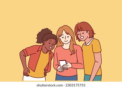 Teenage girls look at mobile phone and laugh at interesting video found on internet. Happy school age girls with smart phone are passionate about app and online games allowing to have fun