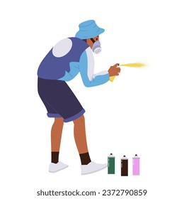 Teenage guy street artist cartoon character wearing respirator painting on wall with spray aerosol