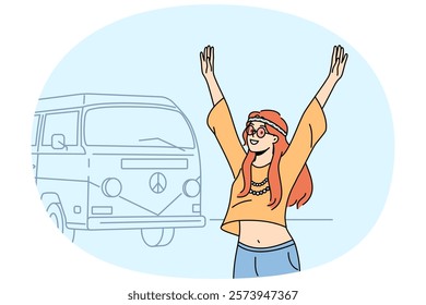 Teenage hippie girl goes on summer travel in minivan and raises hands, rejoicing at opportunity to relax. Young hippie woman standing near tourist van for travel with pacifism symbol