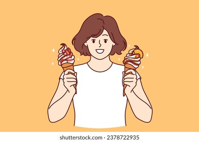 Teenage woman holds two ice creams with fruit syrup and waffle cone and looks at screen smiling. Child offers to try delicious and sweet ice creams to refresh yourself in hot summer weather