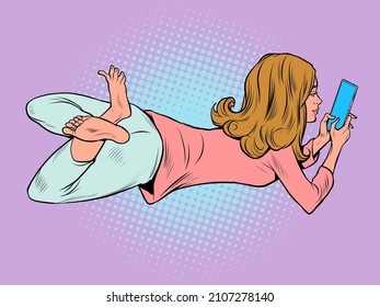 a teenage woman lies and watches a smartphone, lifestyle new technologies, chat on social networks. Pop Art Retro Vector Illustration Vintage Kitsch 50s 60s Style