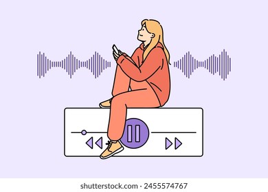 Teenage woman listens to music on phone, sitting near equalizer on buttons to control playlist. Music lover girl uses audio application on smartphone to play favorite songs or audio books