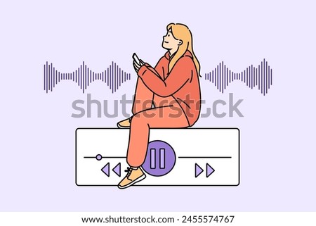 Teenage woman listens to music on phone, sitting near equalizer on buttons to control playlist. Music lover girl uses audio application on smartphone to play favorite songs or audio books