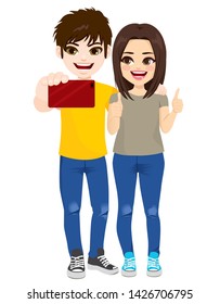 Teenager boy and girl taking selfie with smartphone happy smiling and thumbs up