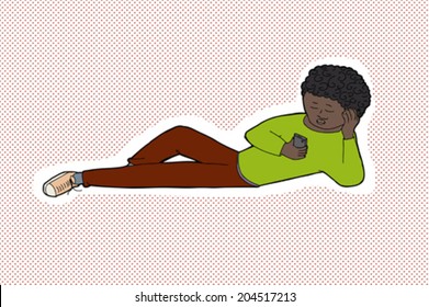 Teenager with curly hair reading messages on telephone