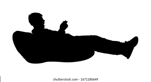 Teenager Gamer Boy Playing Video Game And Watching Screen Monitor Vector Silhouette Isolated On White Background. Kid With Joystick On Lazy Bed Enjoying. Children Entertainment. 