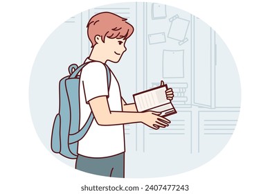 Teenager guy with backpack behind back stands near lockers in college room and flips through textbook. Student prepares for lesson by choosing right books and workbooks from safe. Flat vector image