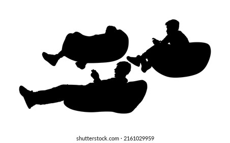 Teenagers gamer boys playing video game and watching screen monitor vector silhouette illustration isolated on white background. Friends with joystick on lazy bed enjoying.  Children entertainment