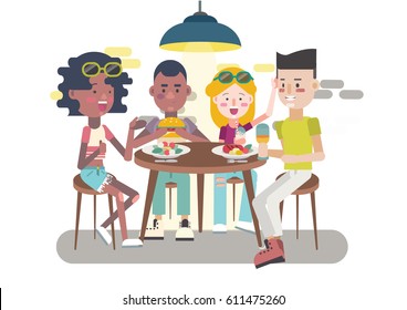 Teens eating, chatting and having fun at restaurant