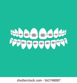 Teeth with braces on the green background. Vector illustration