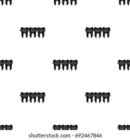 Teeth with dental braces icon in black style isolated on white background. Dental care symbol stock vector illustration.