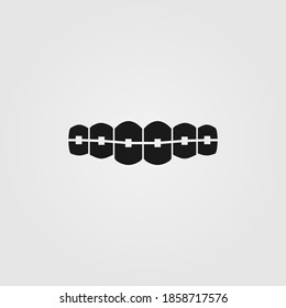 Teeth with dental braces icon in line style isolated on white background. Orthodontic braces for oral care concept, logo and UI design.