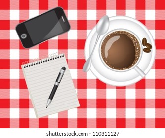 telephone, coffee and a notebook on the background cloth
