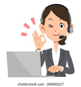 Telephone operator showing the hand sign of OK