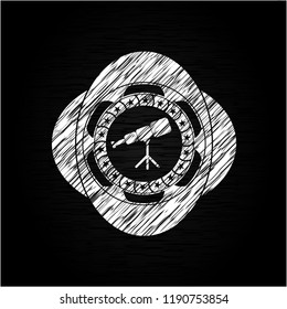 telescope icon drawn on a blackboard