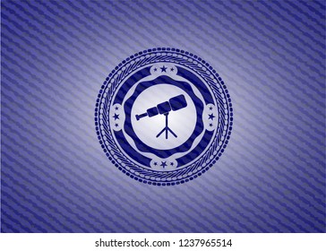 telescope icon inside badge with jean texture
