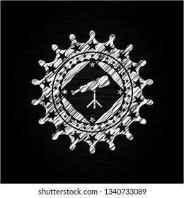 telescope icon inside chalkboard emblem on black board