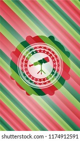 telescope icon inside christmas colors style badge.