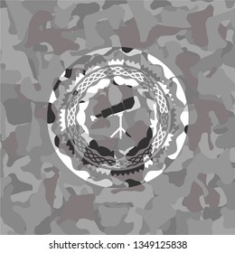 telescope icon inside grey camo texture