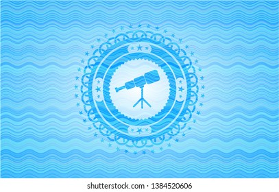 telescope icon inside light blue water wave badge.