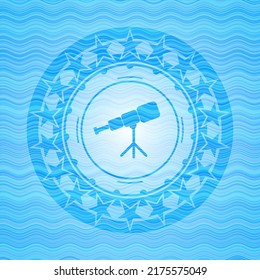 telescope icon inside sky blue water style emblem. 