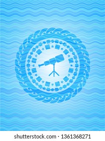 telescope icon inside water badge background.