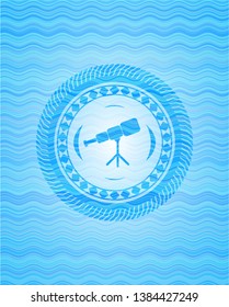 telescope icon inside water wave representation badge.