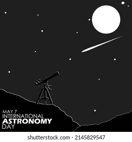 A telescope on top of a hill is aiming at a shooting star at night with a full moon and stars and bold texts, International Astronomy Day May 7