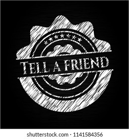 Tell a friend written on a blackboard