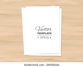 Template of a blank paper sheets on a wooden background. EPS 10 vector. 