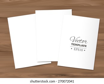 Template of a blank paper sheets on a wooden background. EPS 10 vector. 
