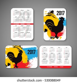 template design pocket calendar 2017 with emblems of Chinese Year of the Rooster. vector illustration. Vertical and horizontal pocket calendar page