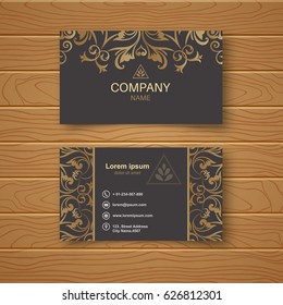 Template of the empty business card on a wooden table. The card with a flower pattern in Baroque style. Vector illustration.