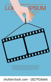 Template for festival retro cinema. Hand holding film strip on blue background. Cinema background. Movie template concept for festival, banner, brochure, flyer, leaflet, poster. Art design filmstrip.