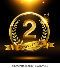 Template golden logo 2nd anniversary with ring and laurel branches on dark background