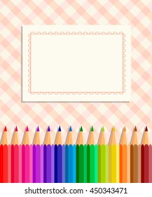 Template greeting card or cover: colored pencils on a fabric background in a cage; in the center place for Your text. Back to school.