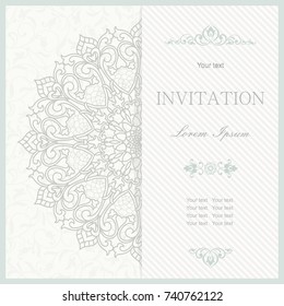 Template greeting card, invitation and advertising banner, brochure with space for text. Vintage Invitation or wedding card with mandala pattern and elegant floral elements in grey