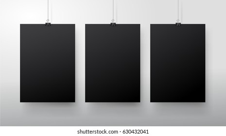 Template of three black blank vector posters. Set of mockups hanging on the wall. Frame for paper sheet. Isolated on gray background. Vector illustration EPS 10.