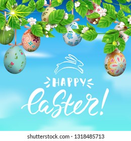 Template vector card with realistic colorful 3D eggs and twigs blossom cherry. Handwritten inscription Happy Easter. Sunny background. Decorated eggs hang on a tree. Modern calligraphy. Blue sky.