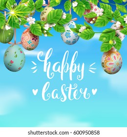 Template vector card with realistic colorful eggs and blossom cherry. Handwritten inscription Happy Easter. Bright sunny background. 3D. Decorated eggs hang on a tree. Modern calligraphy.