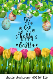 Template vector card with realistic colorful eggs, tulips and blossom cherry. Handwritten inscription Happy Easter and bunny. Sunny background. 3D. Decorated eggs hang on a tree. Modern calligraphy.