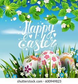 Template vector card with realistic decorated eggs, grass, flowers and  blossom cherry. Handwriting inscription Happy Easter. Bright sunny green background. Tree branches.  Lettering, calligraphy. 3D.