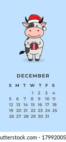 Template for a Wall calendar for 2021. The year of the ox in the Eastern Chinese calendar. Cute character ox, bull or cow. Ready-to-print poster. Flat design.