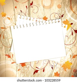 Template at wooden background over maple red and yellow leaves, copyspace for your text