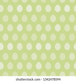 Tender light green Happy Easter seamless pattern with white decorated eggs. Gentle ornamental eggs texture for Easters package, gift wrapping paper, textile, covers, background