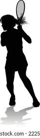 A tennis player woman female sports person in silhouette